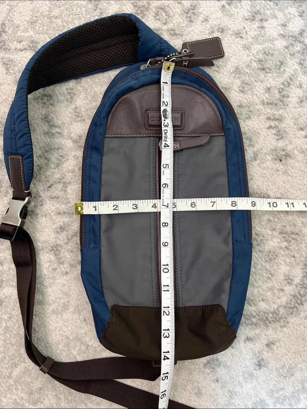 COACH Varick sling bag in navy blue / gray nylon with brown leather trim